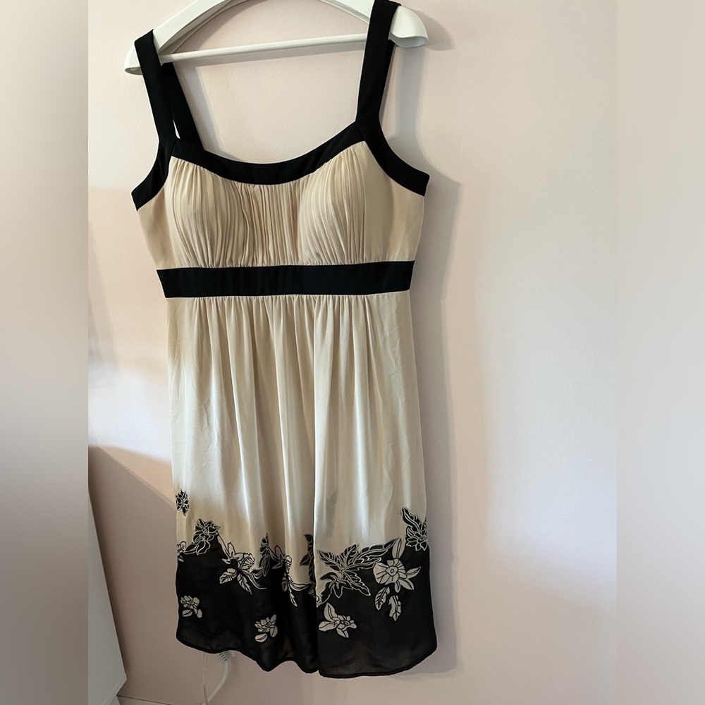 Light sheer dress, zip up back. Looks fab with a little black cardigan or shawl